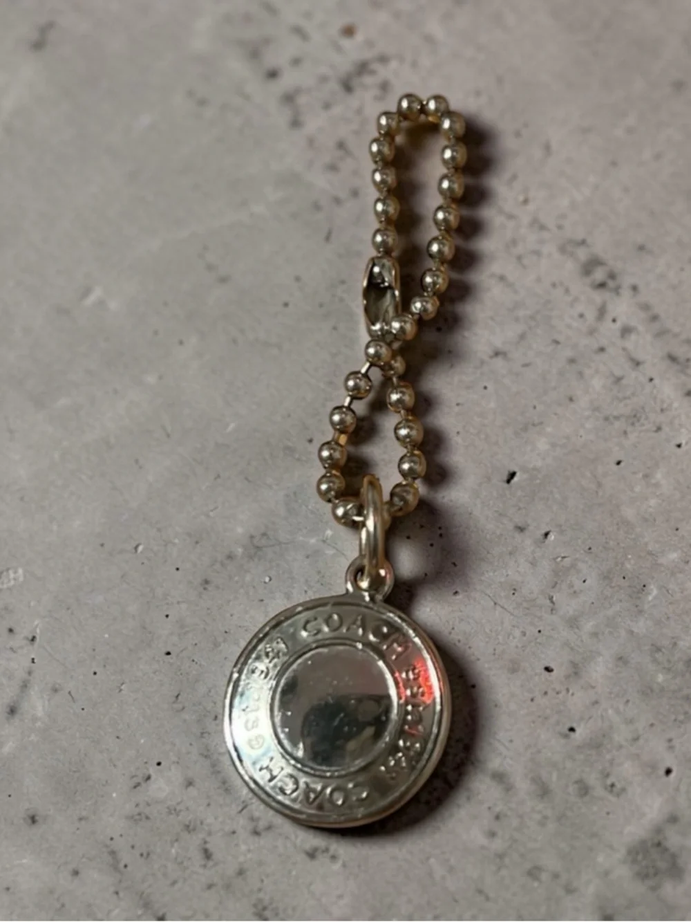 Coach Silver Medallion Hang Tag